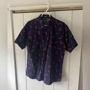 Short sleeve button down shirt with cherry pattern. Navy blue, size large